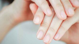 Close-up of woman's fingernail. Hand concept.